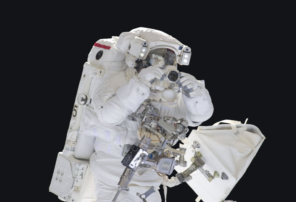 Astronaut uses a digital still camera during a spacewalk Canvas Art - Stocktrek Images (34 x 24)