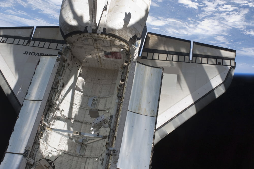 Astronaut working inside the payload bay of Space Shuttle Endeavour Canvas Art - Stocktrek Images (34 x 23)