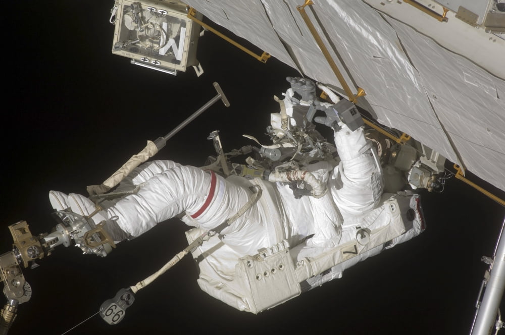 Astronaut working on the International Space Station during a spacewalk Canvas Art - Stocktrek Images (34 x 23)