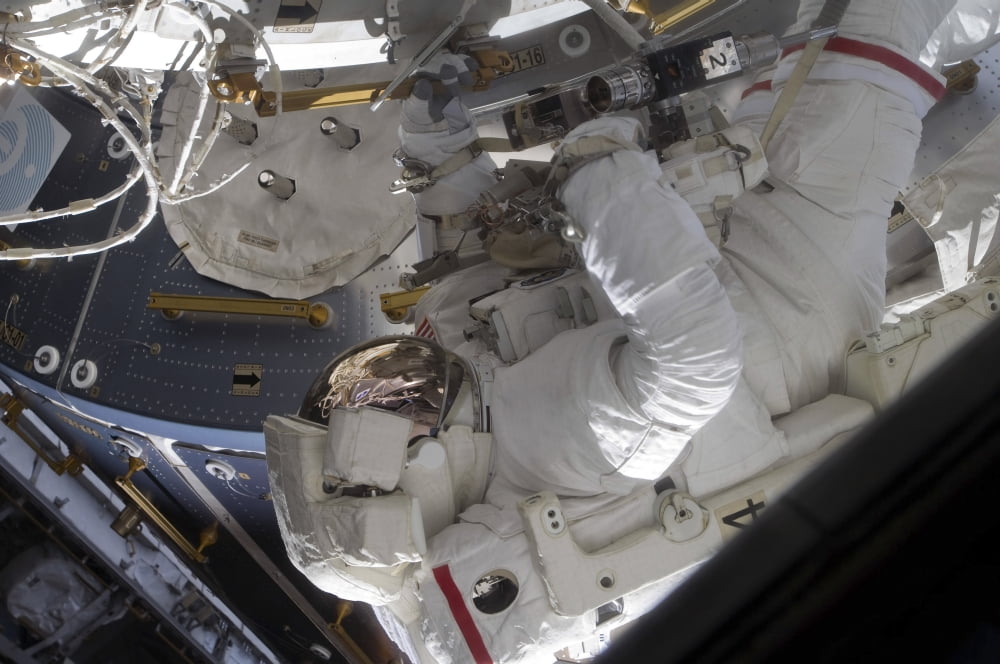 Astronaut working on the International Space Station during a spacewalk Canvas Art - Stocktrek Images (34 x 23)