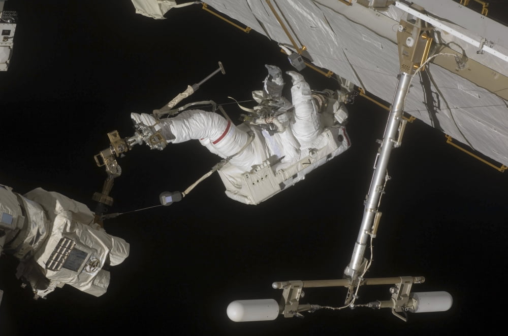 Astronaut working on the International Space Station during a spacewalk Canvas Art - Stocktrek Images (34 x 23)