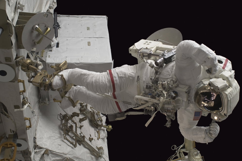 Astronaut working on the International Space Station during a spacewalk Canvas Art - Stocktrek Images (34 x 23)