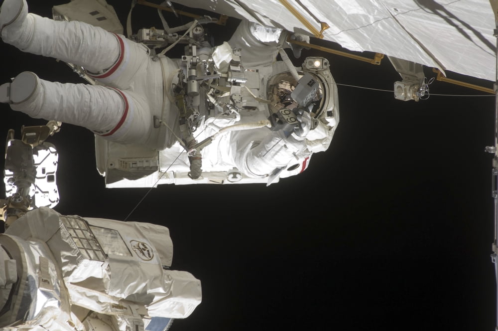 Astronaut working on the International Space Station during a spacewalk Canvas Art - Stocktrek Images (35 x 23)