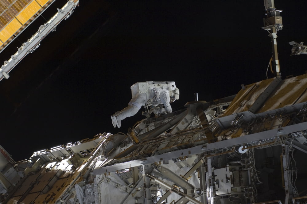 Astronaut working on the International Space Station during a spacewalk Canvas Art - Stocktrek Images (35 x 23)
