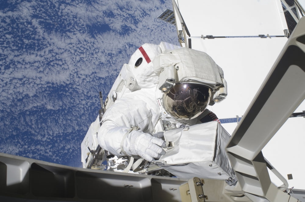 Astronaut working on the International Space Station during a spacewalk Canvas Art - Stocktrek Images (35 x 23)