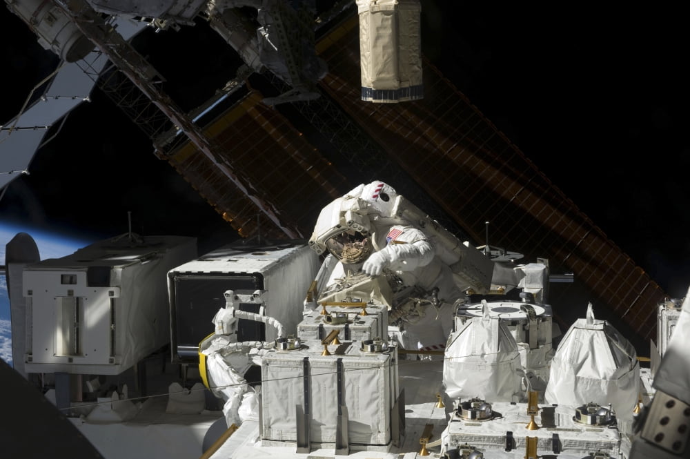 Astronaut working on the Japanese Experiment Module - Exposed Facility Canvas Art - Stocktrek Images (34 x 23)