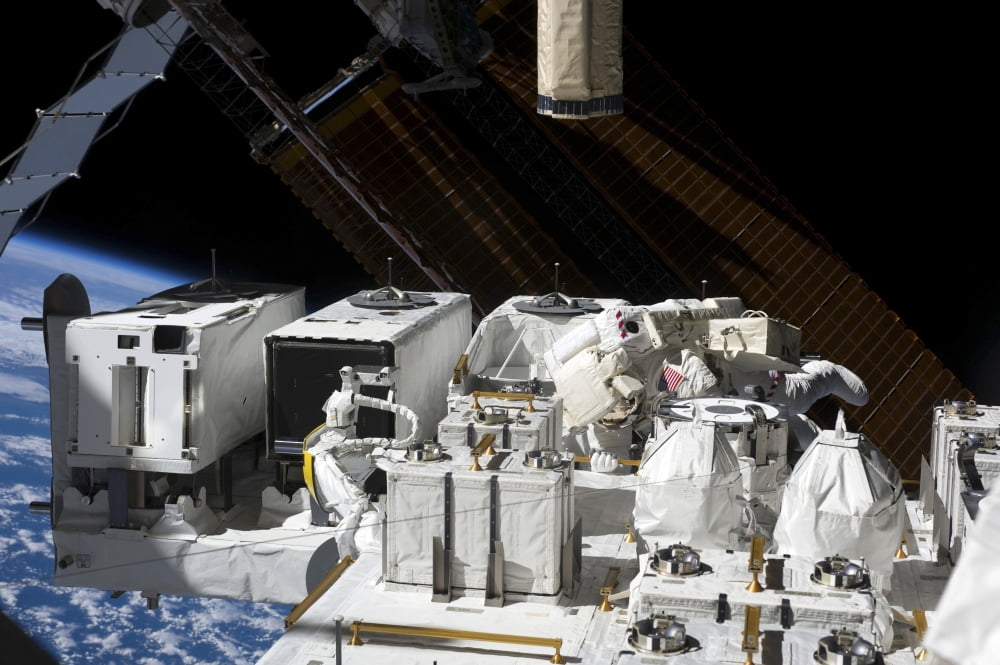 Astronaut working on the Japanese Experiment Module - Exposed Facility Canvas Art - Stocktrek Images (34 x 23)