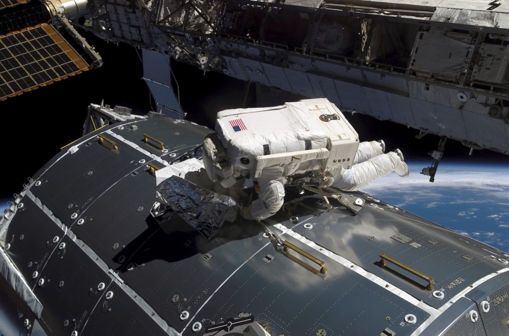 Astronaut works on the new Columbus laboratory during a spacewalk Canvas Art - Stocktrek Images (34 x 23)