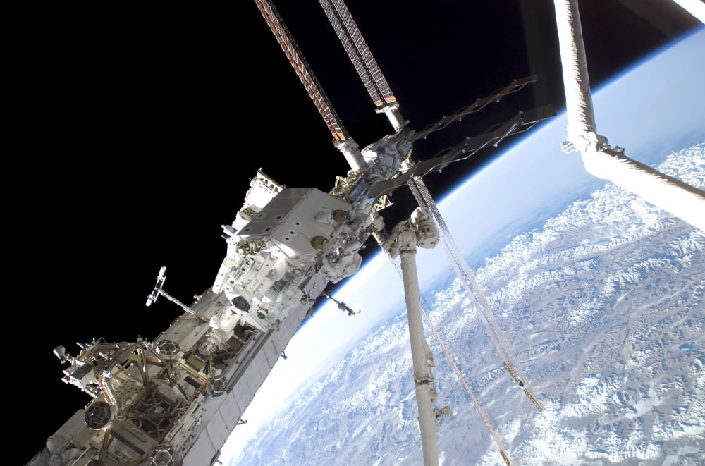 Astronauts assemble the stick-figure-shaped Dextre Canvas Art - Stocktrek Images (34 x 23)