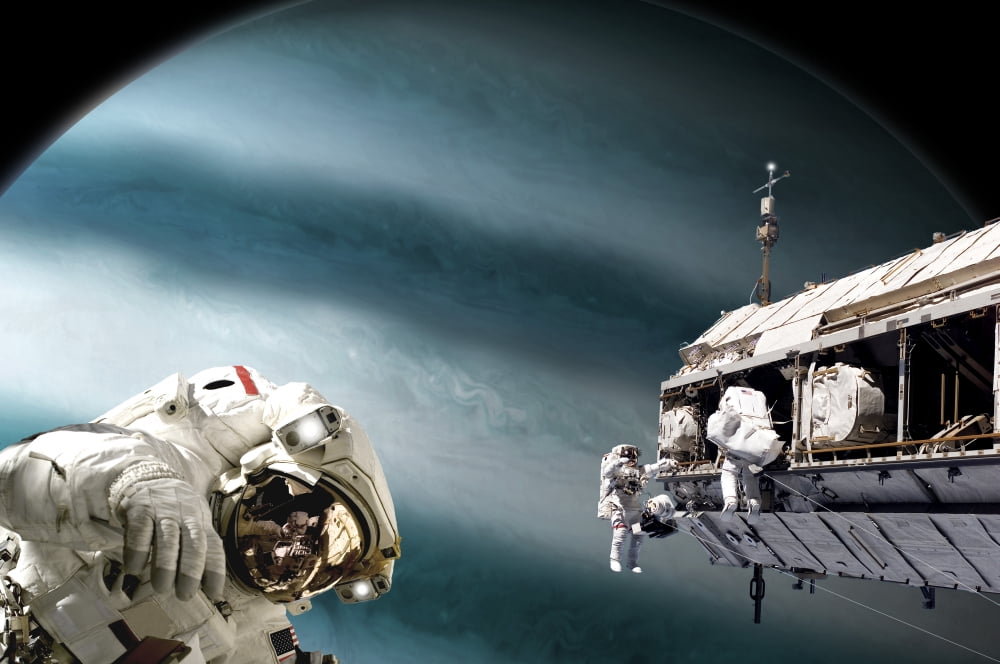 Astronauts performing work on a space station while orbiting a Jupiter-like planet Canvas Art - Marc WardStocktrek Images (35 x 23)