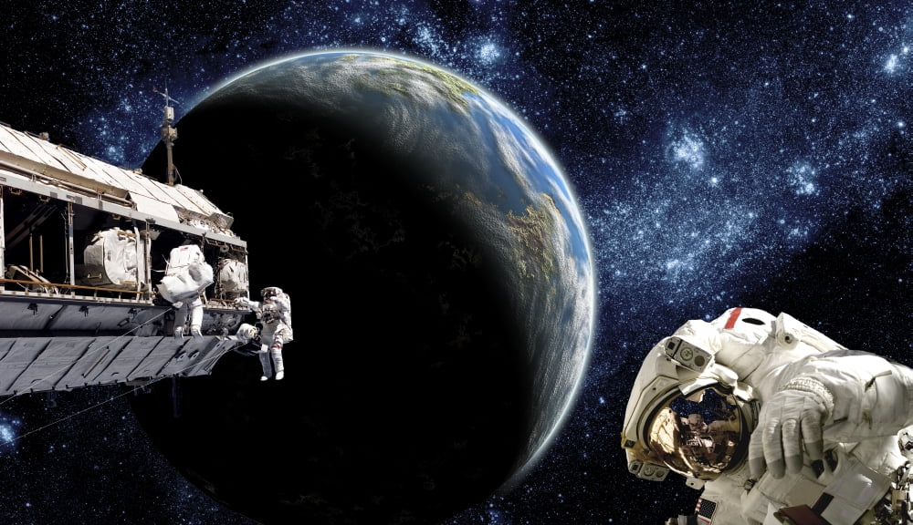Astronauts performing work on a space station while orbiting an Earth-like planet Canvas Art - Marc WardStocktrek Images (37 x 21)