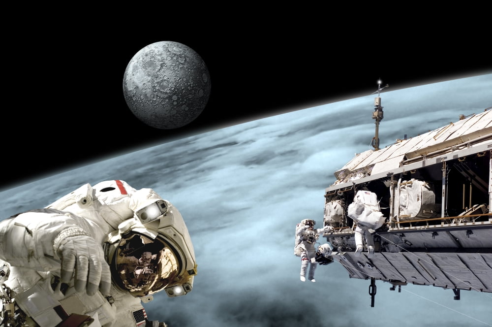 Astronauts performing work on a space station while orbiting an alien world with moonrise Canvas Art - Marc WardStocktrek Images (35 x 23)