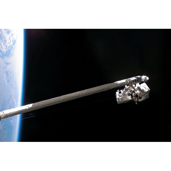 Astronauts work in tandem on the shuttles Remote Manipulator SystemOrbiter Boom Sensor System Canvas Art - Stocktrek Images (34 x 23)