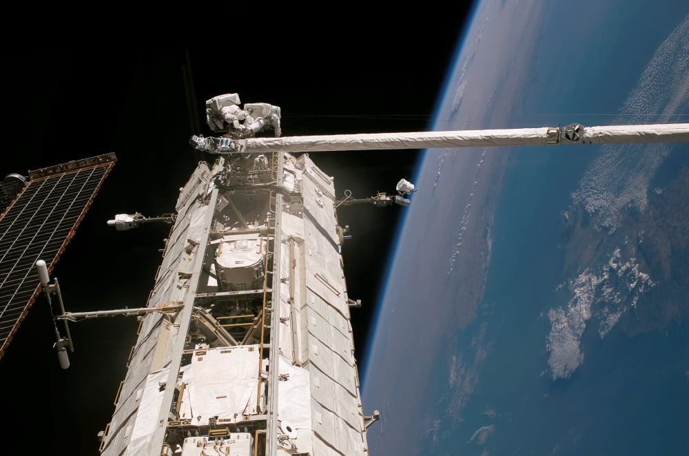Astronauts work on the S0 Truss of the International Space Station Canvas Art - Stocktrek Images (34 x 23)