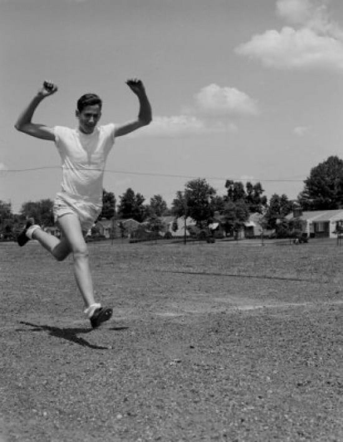 Athlete running on sports track Canvas Art - (18 x 24)