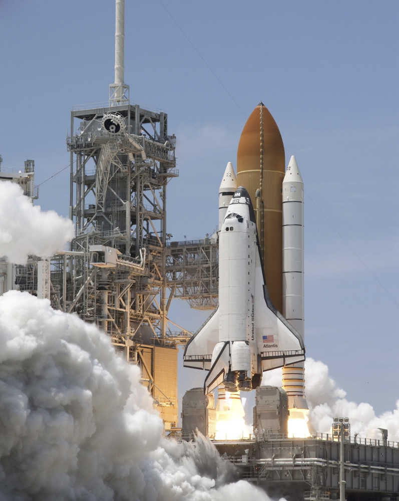 Atlantis twin solid rocket boosters ignite to propel the spacecraft into orbit at Kennedys Space Center Canvas Art - Stocktrek Images (25 x 32)