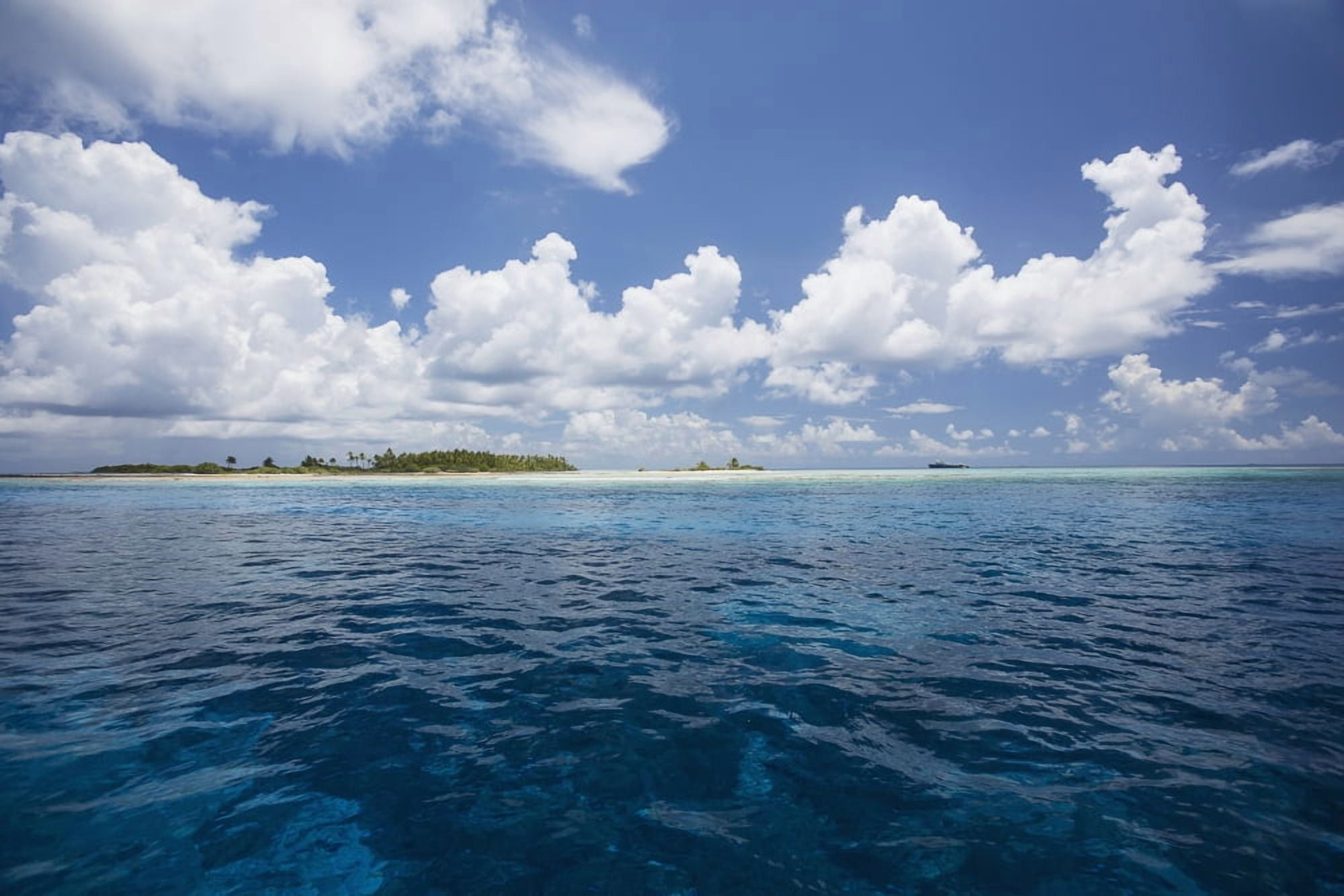Atoll with ship in the distance Tahiti Canvas Art - Eric Kulin Design Pics (19 x 12)