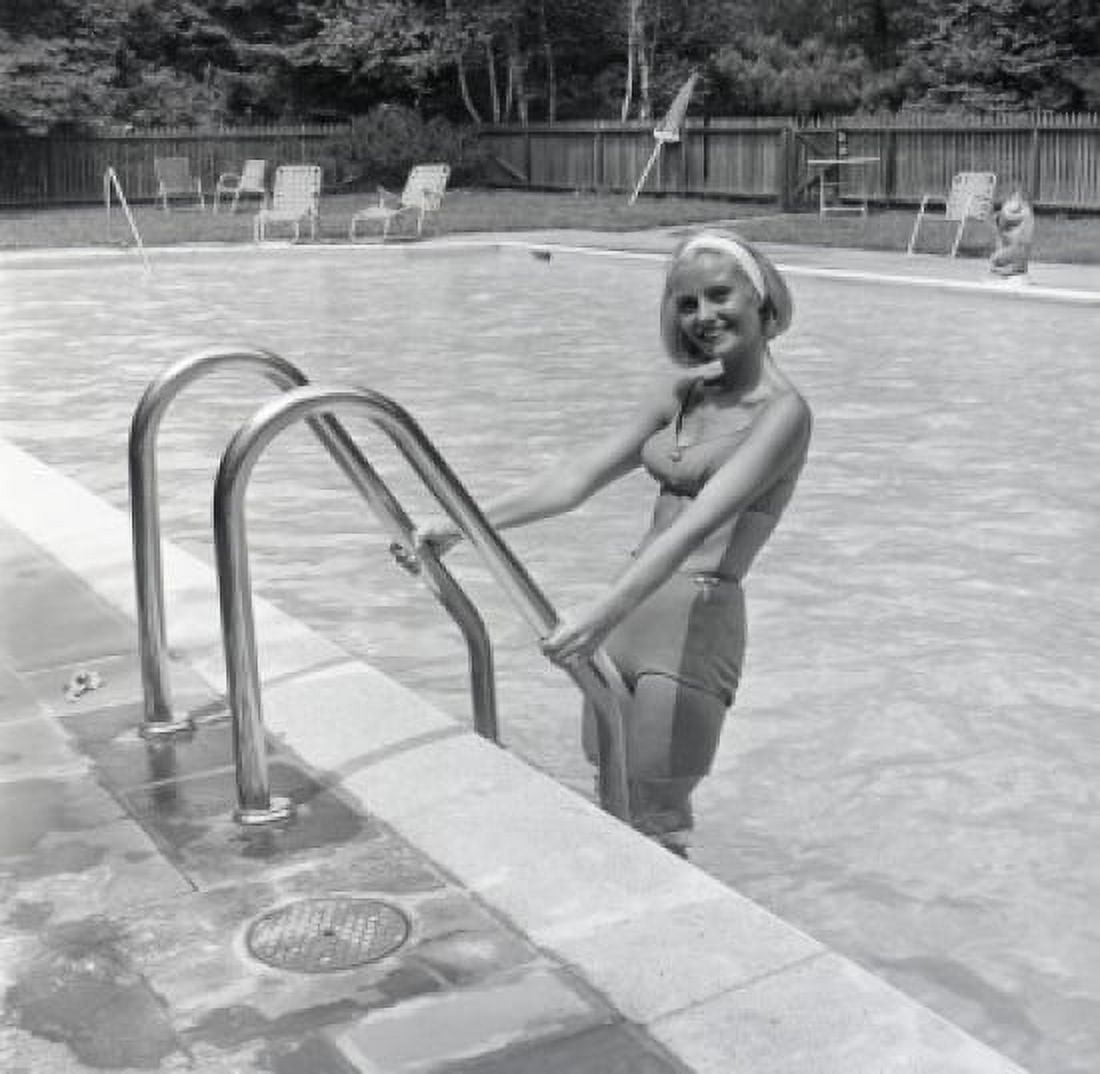 Attractive young woman standing in swimming pool Canvas Art - (18 x 24)