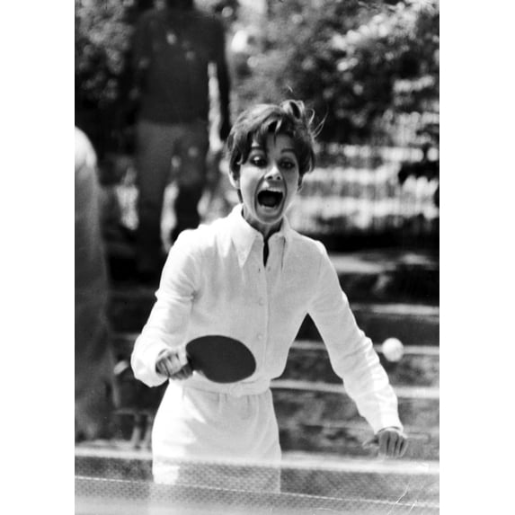 Audrey Hepburn playing table tennis Photo Print (8 x 10)
