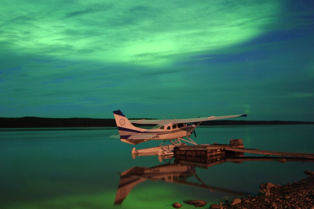 Aurora Borealis Or Northern Lights Over Float Plane And Mackenzie River Fort Simpson Northwest Territories Canvas Art - Robert Postma Design Pics (17 x 11)