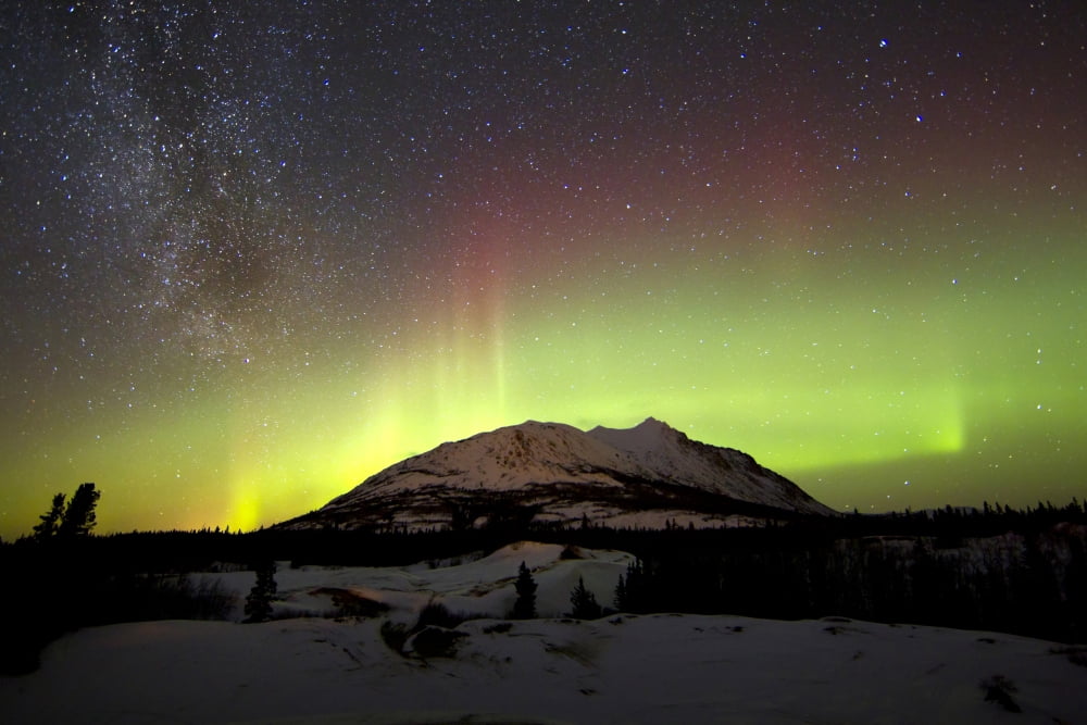 Aurora borealis and Milky Way over Carcross Desert Canada Canvas Art - Joseph BradleyStocktrek Images (35 x 23)