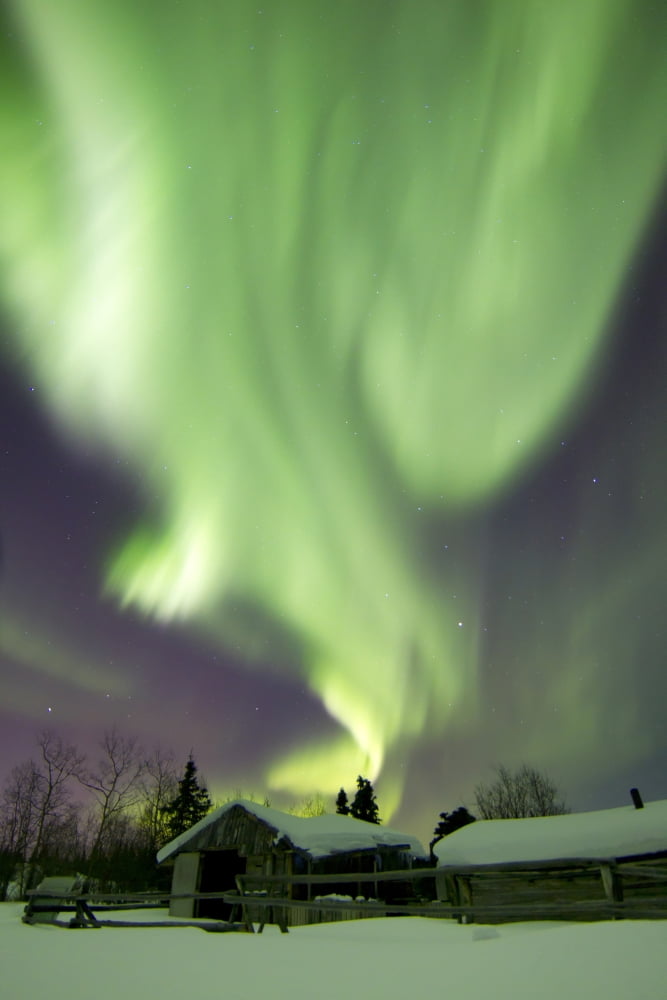 Aurora borealis and the Big Dipper above a log cabin at Whitehorse Yukon Canada Canvas Art - Joseph BradleyStocktrek Images (23 x 35)