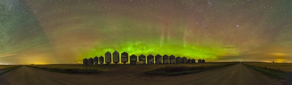 Aurora borealis behind grain bins on a country road in Alberta Canada Canvas Art - Alan DyerStocktrek Images (26 x 8)