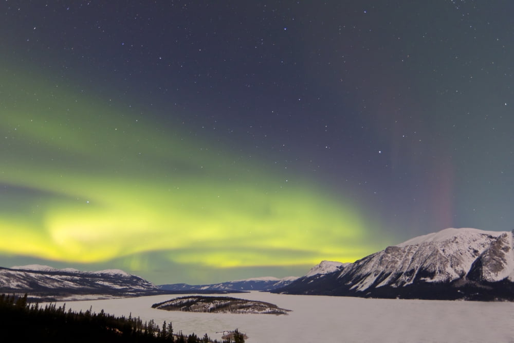 Aurora borealis over Bove Island Yukon Canada Canvas Art - Joseph BradleyStocktrek Images (18 x 12)