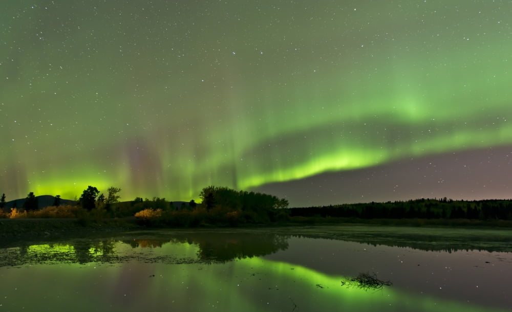 Aurora borealis over Fish Lake Whitehorse Yukon Canada Canvas Art - Jonathan TuckerStocktrek Images (18 x 11)