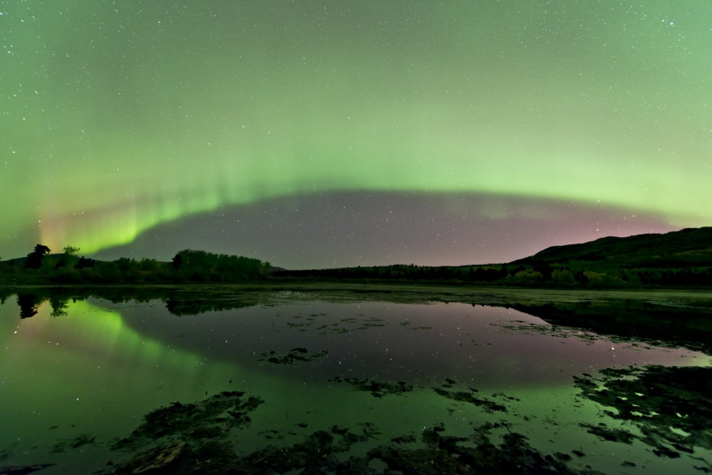 Aurora borealis over Fish Lake Whitehorse Yukon Canada Canvas Art - Jonathan TuckerStocktrek Images (18 x 12)
