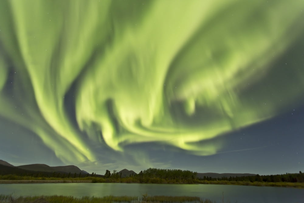 Aurora borealis over Fish Lake Yukon Canada Canvas Art - Jonathan TuckerStocktrek Images (35 x 23)