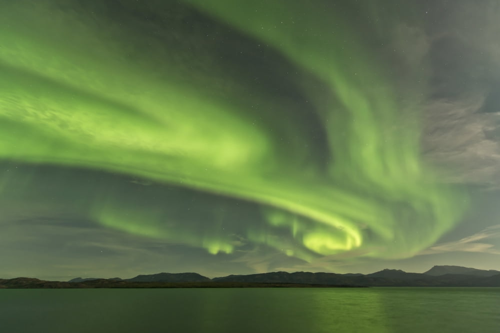 Aurora borealis over Fish Lake Yukon Canada Canvas Art - Jonathan TuckerStocktrek Images (35 x 23)