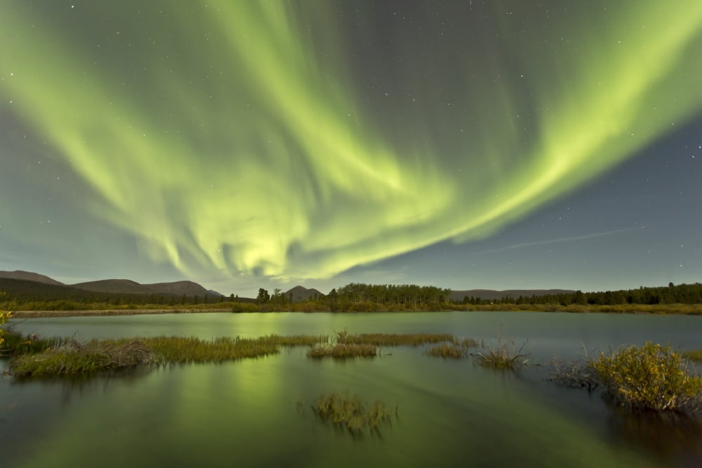 Aurora borealis over Fish Lake Yukon Canada Canvas Art - Jonathan TuckerStocktrek Images (35 x 23)