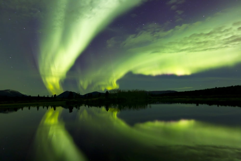 Aurora borealis over Fish lake Whitehorse Yukon Canada Canvas Art - Joseph BradleyStocktrek Images (35 x 23)