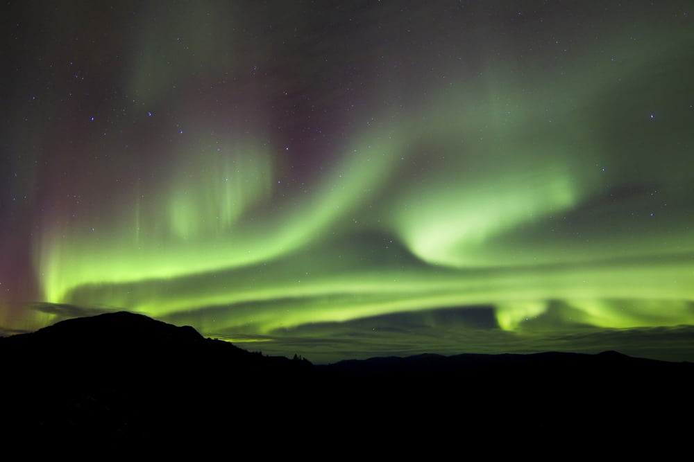 Aurora borealis over Gray Peak Whitehorse Yukon Canada Canvas Art - Joseph BradleyStocktrek Images (35 x 23)