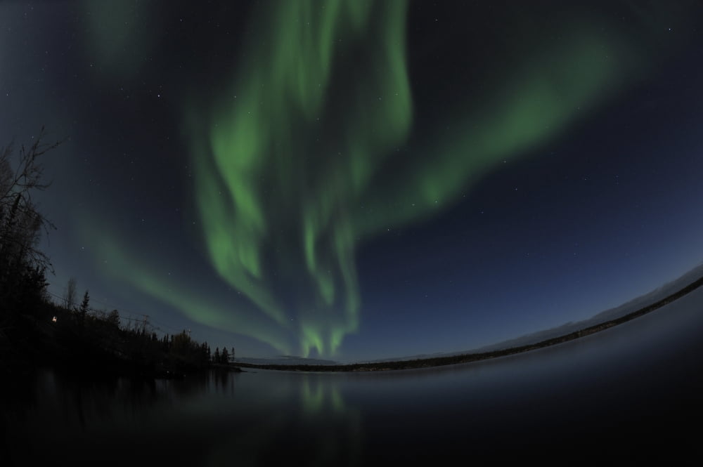 Aurora borealis over Long Lake Northwest Territories Canada Canvas Art - Jiri HermannStocktrek Images (35 x 23)