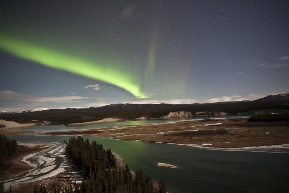 Aurora borealis over Yukon River Yukon Canda Canvas Art - Jonathan TuckerStocktrek Images (35 x 23)