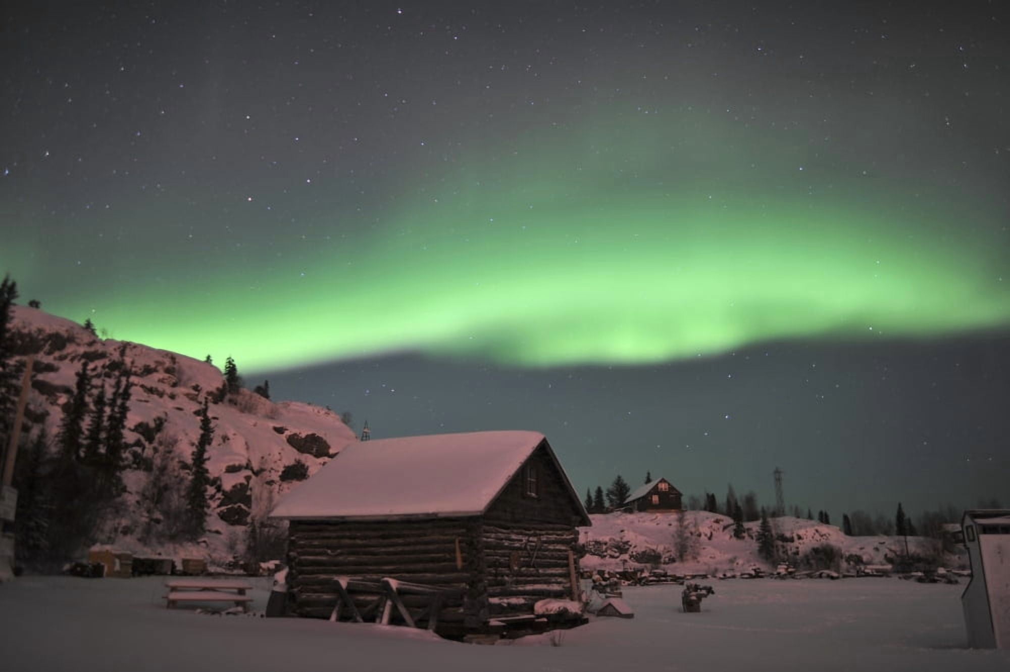 Aurora borealis over a cabin Northwest Territories Canada Canvas Art - Jiri HermannStocktrek Images (18 x 12)