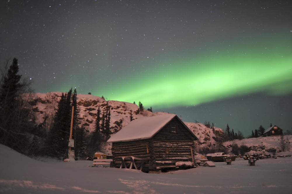 Aurora borealis over a cabin Northwest Territories Canada Canvas Art - Jiri HermannStocktrek Images (35 x 23)