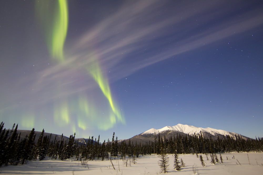 Aurora borealis over mountain near Mayo Yukon Canada Canvas Art - Joseph BradleyStocktrek Images (18 x 12)