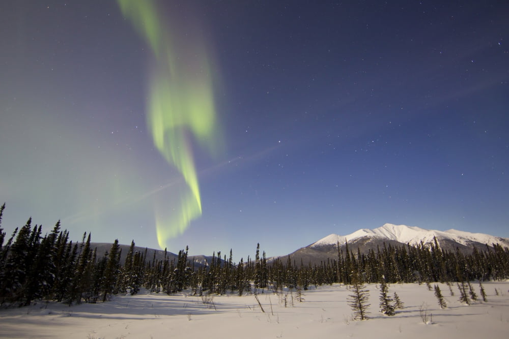 Aurora borealis over mountain near Mayo Yukon Canada Canvas Art - Joseph BradleyStocktrek Images (35 x 23)