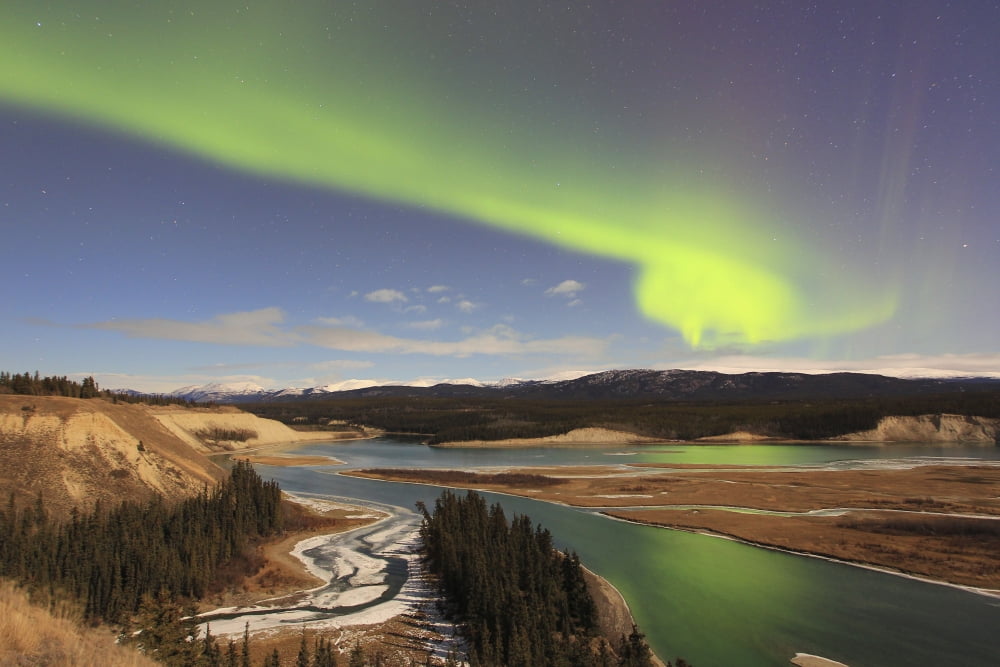 Aurora borealis over the Yukon River Whitehorse Yukon Canada Canvas Art - Joseph BradleyStocktrek Images (18 x 12)