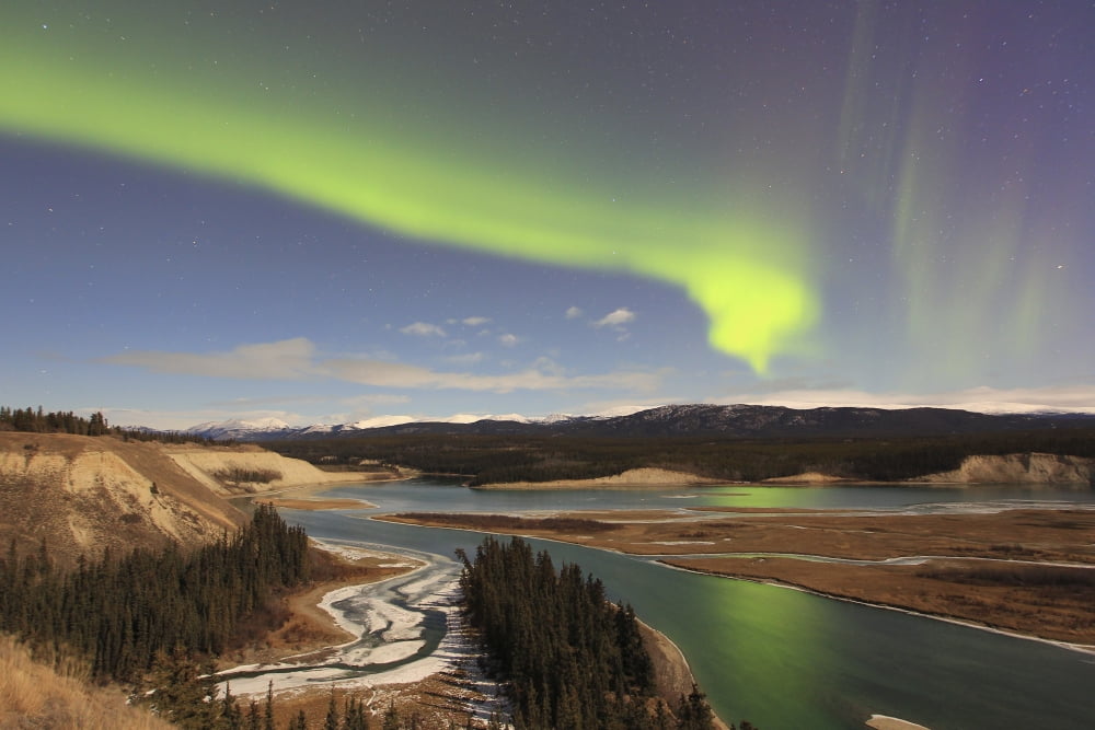 Aurora borealis over the Yukon River Whitehorse Yukon Canada Canvas Art - Joseph BradleyStocktrek Images (18 x 12)
