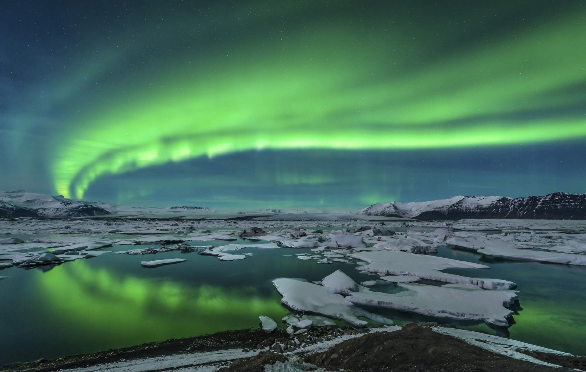 Aurora borealis over the glacial lagoon Jokulsarlon in Iceland Canvas Art - John DavisStocktrek Images (18 x 11)