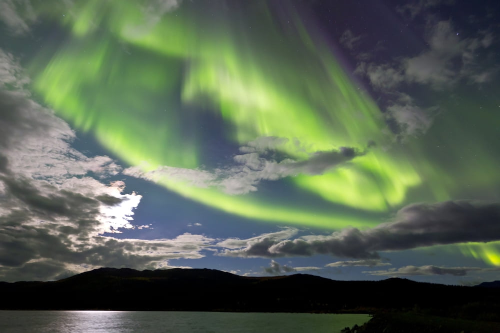 Aurora borealis with moonlight at Fish Lake Yukon Canada Canvas Art - Joseph BradleyStocktrek Images (18 x 12)