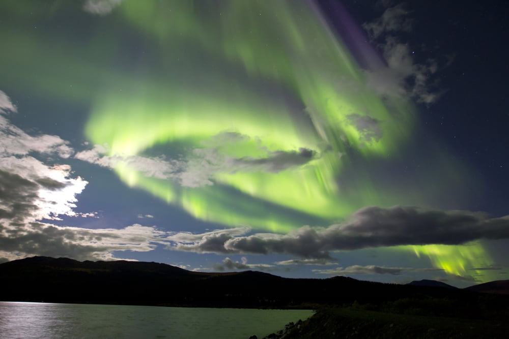 Aurora borealis with moonlight at Fish Lake Yukon Canada Canvas Art - Joseph BradleyStocktrek Images (35 x 23)