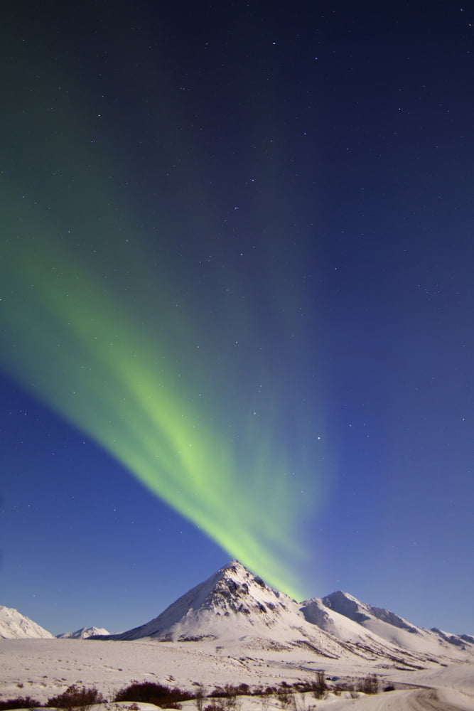 Aurora borealis with moonlight over Ogilvie Mountains Canada Canvas Art - Joseph BradleyStocktrek Images (12 x 18)