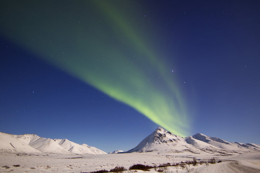 Aurora borealis with moonlight over Ogilvie Mountains Canada Canvas Art - Joseph BradleyStocktrek Images (18 x 12)