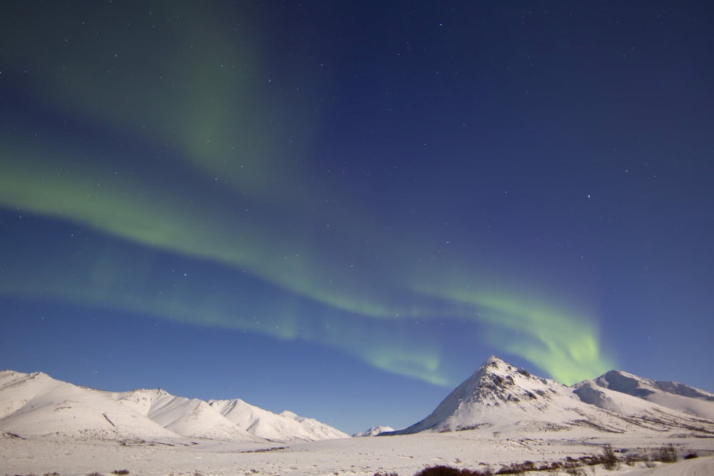 Aurora borealis with moonlight over Ogilvie Mountains Canada Canvas Art - Joseph BradleyStocktrek Images (18 x 12)