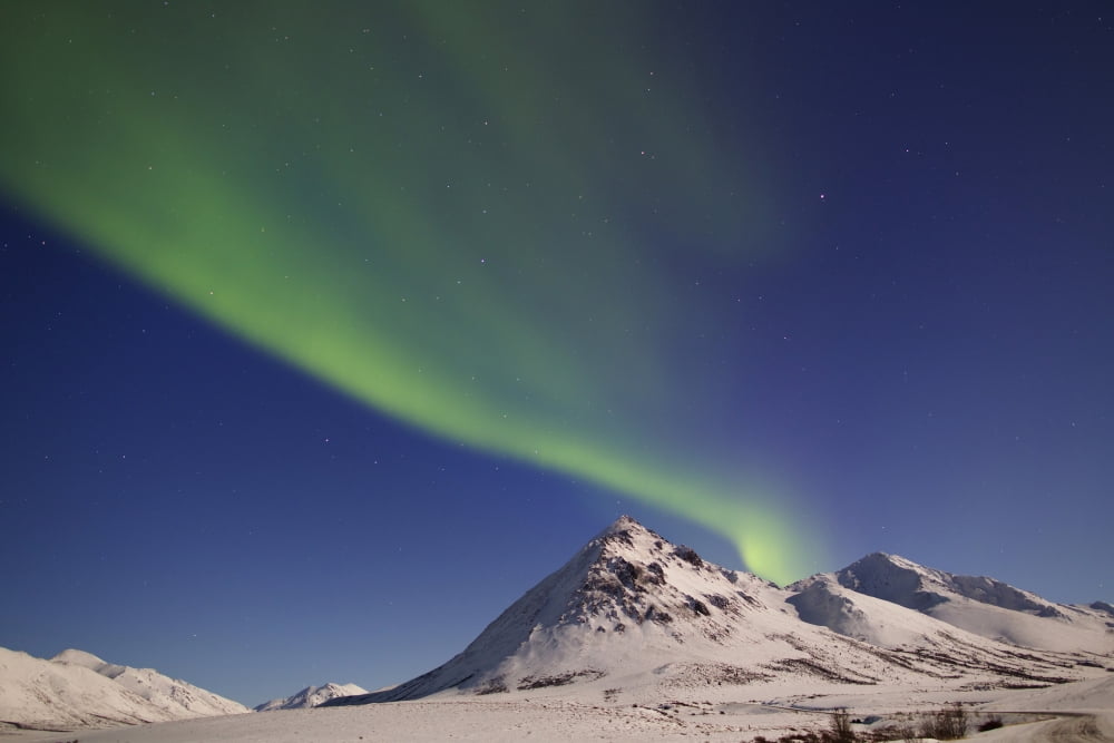 Aurora borealis with moonlight over Ogilvie Mountains Canada Canvas Art - Joseph BradleyStocktrek Images (35 x 23)